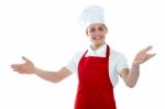 Male Chef Giving Welcome Gesture Stock Photo