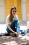 Portrait Of Thai Chinese Adult Glasses Beautiful Girl Denim Blue Bag Relax And Smile Stock Photo