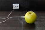 Green Apple Connected To An Ethernet Cable Stock Photo