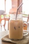 Iced Milk Coffee Glass On Wooden Table With Vintage Filter Effec Stock Photo