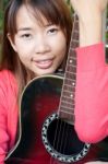 Woman With Guitar Stock Photo