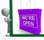 We're Open Shopping Bag Sign Shows New Store Launch Stock Photo