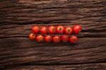 Organic Fresh Cherry Tomatoes On Wooden Background Stock Photo