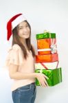 Santa Girl Holding Christmas Gift Stock Photo