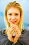 Close-up Of Smiling Young Woman Holding Cup Stock Photo