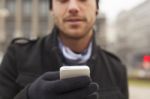 Man With Mobile Phone In Hands Stock Photo