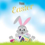 Easter Bunny With Colorful Egg Isolated On White Background. Easter Eggs On The Meadow And A Beautiful Sky Stock Photo