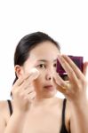 Asian Young Woman Doing Make Up Stock Photo