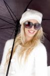 Woman Wearing Cap With Umbrella Stock Photo