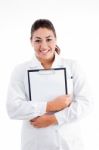 Smiling Doctor Holding Writing Pad Stock Photo