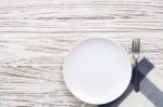 Empty Plate Napkin Fork Silverware White Wooden Table Background Stock Photo