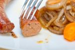 Beef Sausages Cooked On Iron Skillet Stock Photo