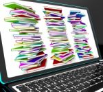 Pile Of Books On Laptop Showing Studying Stock Photo