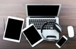 Laptop With Tablet And Smart Phone On Table Stock Photo