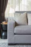 Pillows On Modern Grey Sofa In Living Room Stock Photo