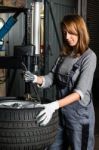 Young Trainee Changing  Car Tyre Stock Photo