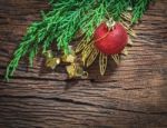 Christmas Fir Tree With Decoration On Dark Wooden Board Stock Photo