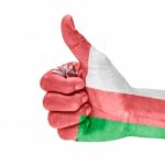 Flag Of Oman On Thumb Up Hand Stock Photo