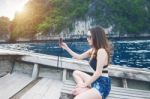 Beautiful Girl In Bikini Selfie On The Boat. Vintage Tone Stock Photo