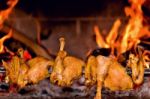 Chicken Roasting On Skewer Stock Photo