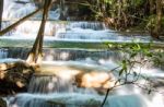 The Water Flowing Over Rocks And Trees Down A Waterfall At Huay Mae Khamin Waterfall National Park ,kanchana Buri In Thailand Stock Photo