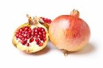 Whole And Halved Pomegranate Stock Photo