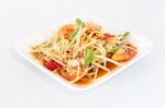 Thai Food Papaya Salad On White Dish Stock Photo