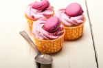 Pink Berry Cream Cupcake With Macaroon On Top Stock Photo