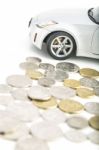 Coins On White With Car Stock Photo