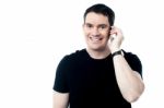 Casual Smiling Man Calling On The Phone Stock Photo