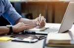 Young Business Man Working In Bright Office, Using Laptop, Writi Stock Photo