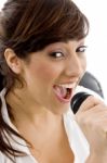 young lady singing with Mic Stock Photo