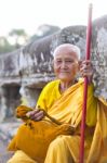 An Unidentified Old Buddhist Female Monk Dressed In Orange Toga Stock Photo