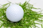 White Golf Ball On Fresh Grass Stock Photo