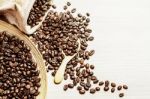 Coffee Beans On The Wooden Stock Photo