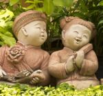 Asian Boy And Girl Statues Stock Photo