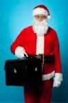 Santa Is All Set To Visit His New Office, Holding Briefcase Stock Photo