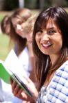 Smiling Modern Female Student In Focus Stock Photo