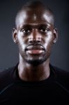 Athletic Man Running In Black Background Stock Photo