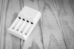 Quick Battery Charger Unit For Charger On Wooden Stock Photo