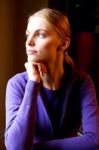 Portrait Of A Young Woman With Hand Under Chin Stock Photo