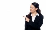 Young Female Executive Pointing At Something Stock Photo