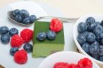 Green Tea Matcha Mousse Cake With Berries Stock Photo