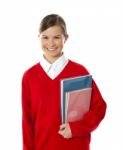 Smiling Schoolgirl Holding Books Stock Photo