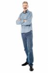 Matured Man Posing With Folded Hands Stock Photo