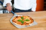 Pizza Taken Out Of The Oven, Ready To Be Served Stock Photo