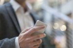 Businessman With Smartphone In Business Building Stock Photo