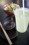 Salmon Spicy Salad And Cold Green Tea Drink Stock Photo