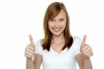 Pretty Teenager Gesturing Double Thumbs Up Stock Photo