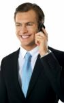 Businessman Talking Over Cellphone Stock Photo